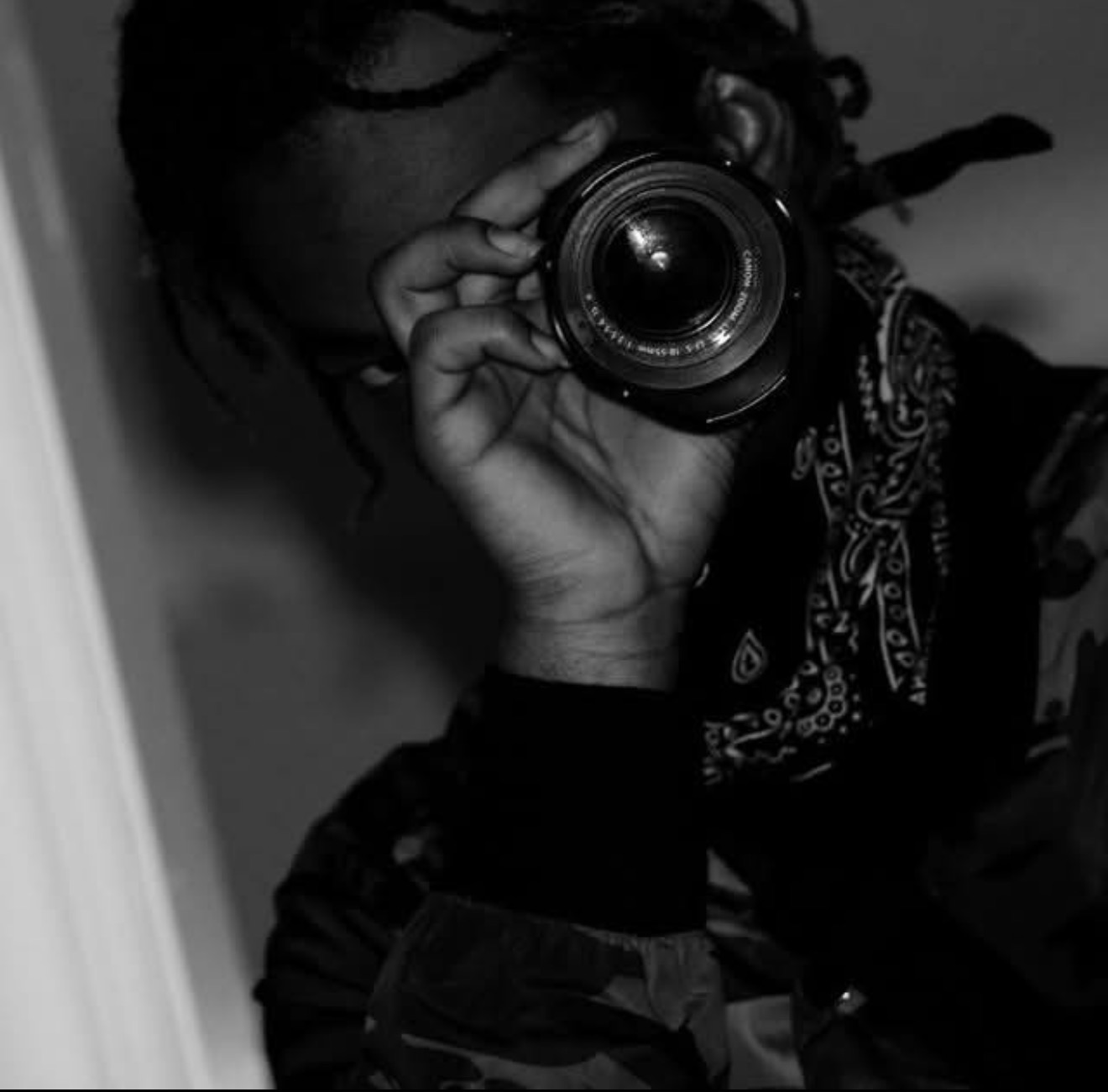 KOLD holding camera lens to eye